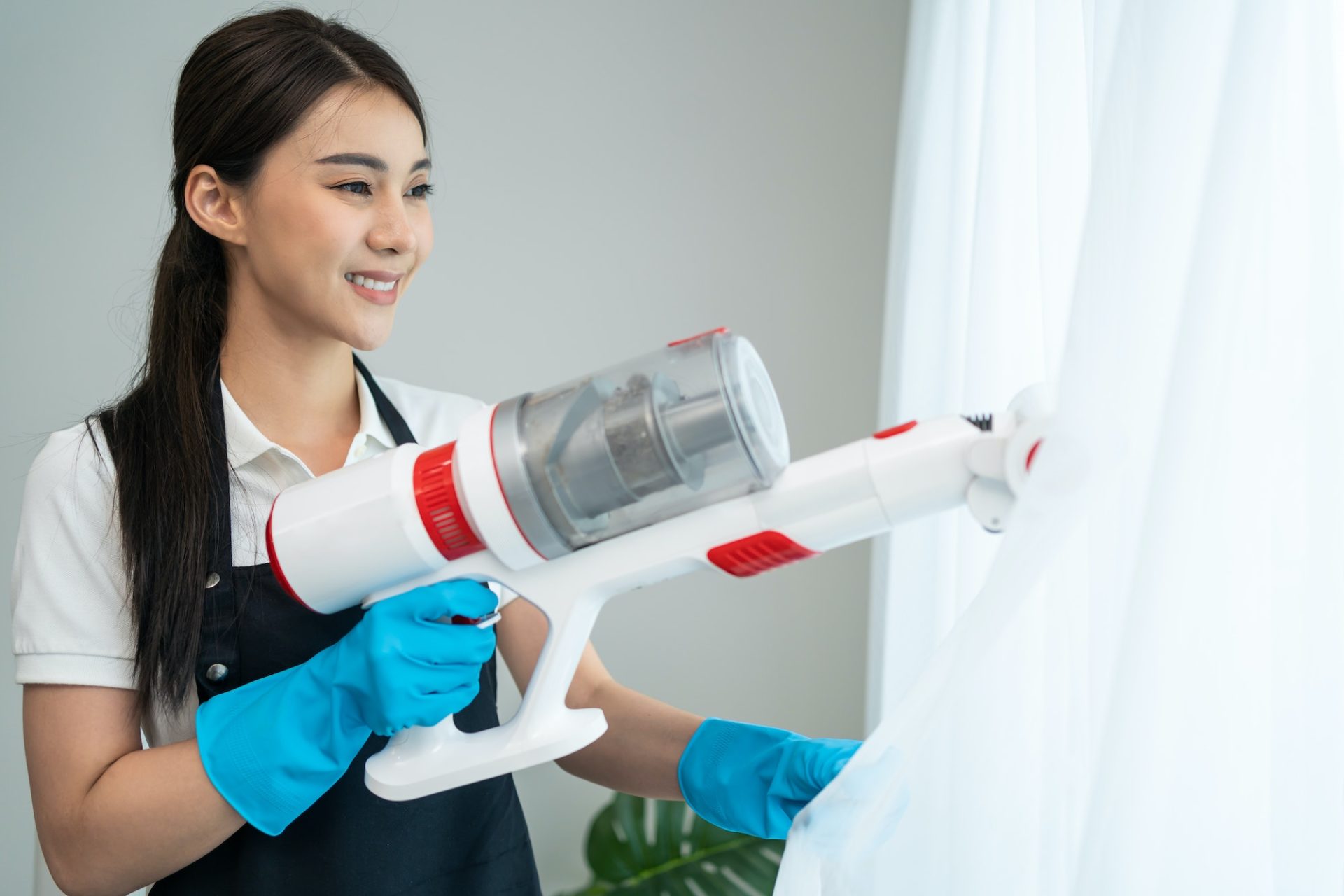 asian-cleaning-service-woman-worker-cleaning-in-living-room-at-home-1-1-e1680687963757.jpg